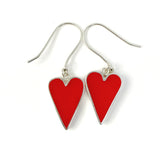 Red heart-shaped earrings on a white background